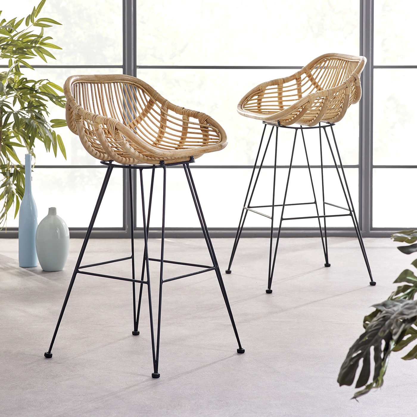 Contemporary Bodan rattan bar stools with woven bucket seats and industrial style black metal legs